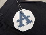a tag with the letter a on it hanging from a shirt
