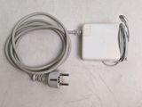 an apple power adapter and charger sitting on a table