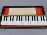 a piano that is sitting in a case on a table