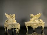 pair of carved ivory figurines of angels on a table