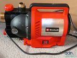 an image of a red and black pump on the floor