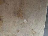 a brown piece of paper on a white surface