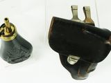 a small black case with a brass handle and a small black case with a brass handle