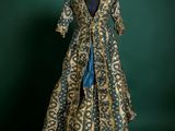 a green and gold dress on a mannequin mannequin mannequin mannequin mannequin mannequin mannequin mannequin mann