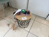 a small table with a book on top of it