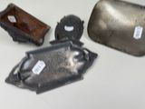 several pieces of metal sitting on top of a table next to each other