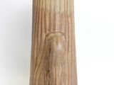 a wooden vase with a horse head carved into it