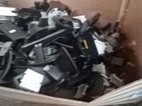 a cardboard box full of electronic components in it