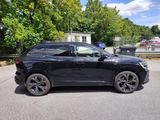 a picture of a black suv parked in a parking lot