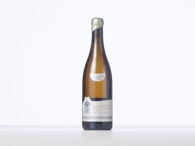 a bottle of white wine sitting on top of a table