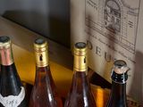 several bottles of wine are sitting in a box on a table