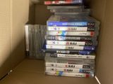 a lot of dvds in a box on top of each other