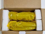 a cardboard box with three rolls of toilet paper in it