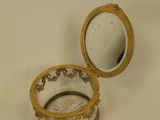 a small glass box with a mirror inside of it