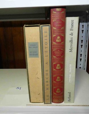 two books that are sitting on a shelf together