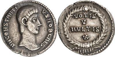 a silver coin with an image of a woman on it