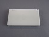 an image of a white nintendo wii game console sitting on a table