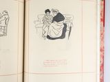 an open book with a drawing of a man and a woman sitting on a couch