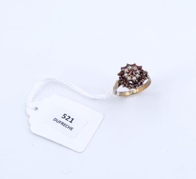 une image représentant une bague surmontée d'une pierre marron