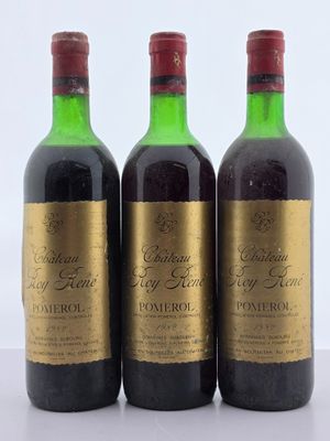 trois bouteilles de vin posées l'une à côté de l'autre sur une table