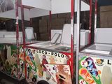 a food cart that has a lot of food on it