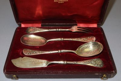 silverware in a red case on a table with a red cloth