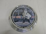 a picture of a clock with a picture of a baseball player on it