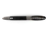 a close up of a pen on a white surface with a white background