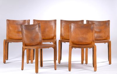 four brown leather dining chairs with wooden legs and backrests