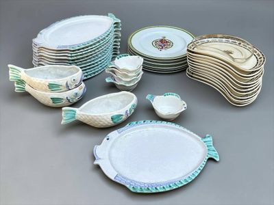 a lot of plates and bowls that are sitting on a table