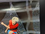 a painting of a woman kicking a soccer ball