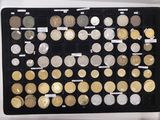 an image of a display case filled with lots of different types of coins