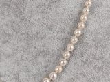 a white pearl necklace on a mannequin mannequin mannequin mannequin mannequin mannequin mannequin mannequin manne