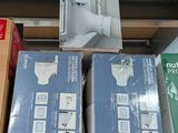 several boxes of electronic devices are stacked on top of each other
