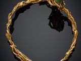 a gold bracelet with a green beetle on top of it