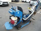 a small machine that is sitting in the parking lot