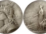 two silver medallions depicting a woman and a man