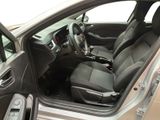 the interior of a car with the door open and the driver ' s seat down