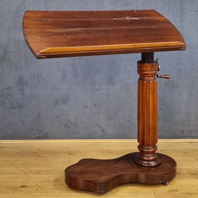 a small wooden table with a wooden top on a wooden floor