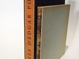 two books are stacked on top of each other on a white surface