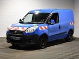 la photo d'une camionnette bleue avec une bande rouge et blanche sur le côté