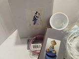 a white box with a picture of a girl in a blue dress on it