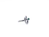 an image of a silver ring with a green stone in the middle