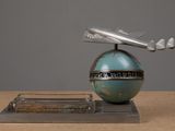 a small model of a plane on top of a globe
