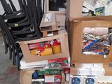 several boxes of assorted items are stacked on pallets in a warehouse