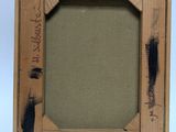 an old picture frame with a picture of a bird on it