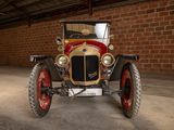 a old car that is parked in a garage