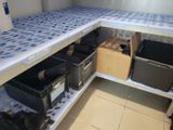 many boxes on the shelf in the room
