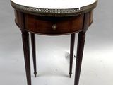 une image représentant une petite table ronde avec un plateau en marbre