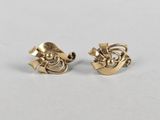 a pair of gold plated earrings